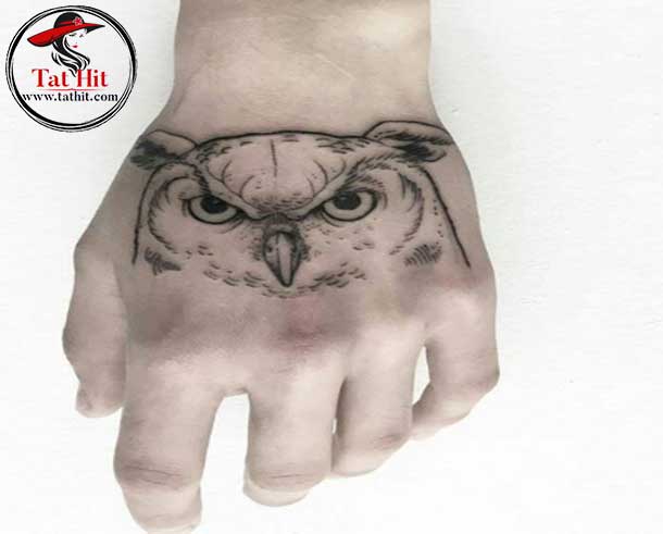 tiny great horned owl head tattoo