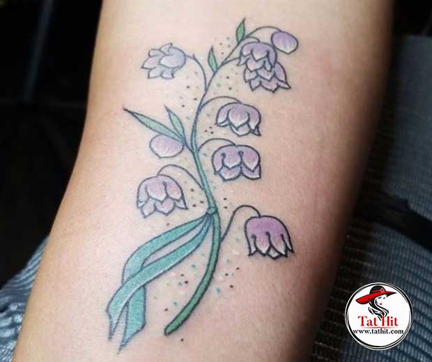 minimalist lily of the valley tattoo
