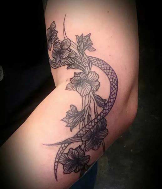 gladiolus tattoo on elbow for women