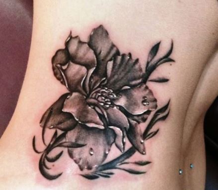 Brown Larkspur Flower Tattoo On Rib