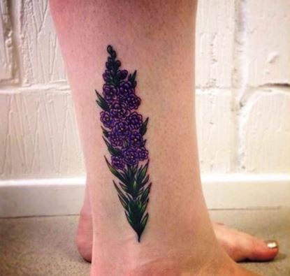 Small Larkspur Flower Tattoo On Leg